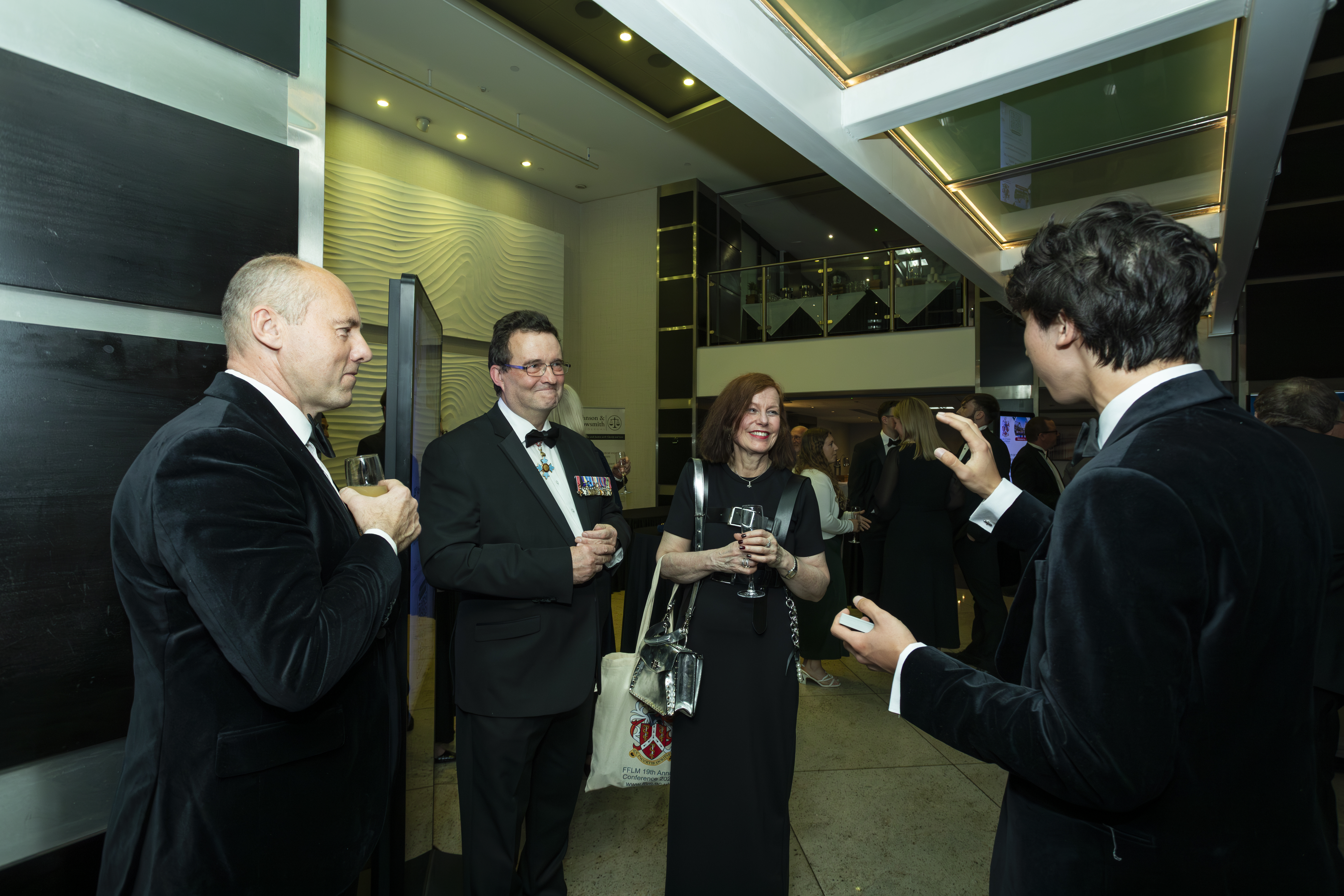 Close-up magic surrounded by guests